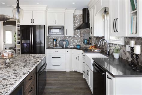 off white cabinets with black stainless steel appliances|black fridge in white kitchen.